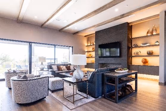 A living room with a tv and couchesAI-generated content may be incorrect.