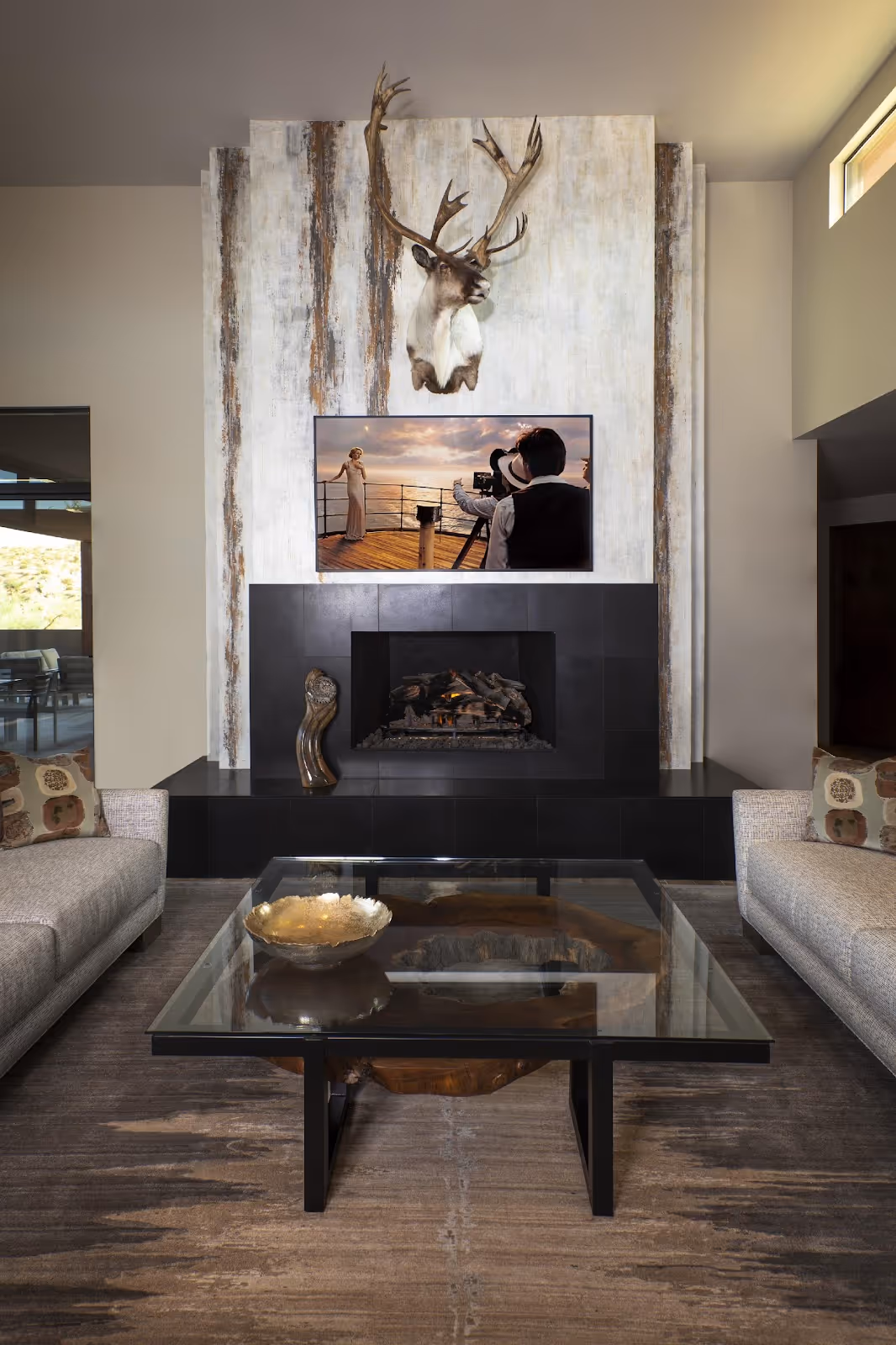 A living room with a fireplace and a tableAI-generated content may be incorrect.