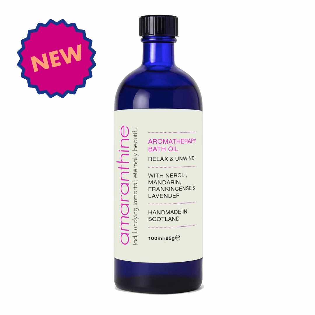 Aromatherapy bath oil in a blue glass bottle featuring neroli, mandarin, frankincense and lavender, handmade in Scotland.