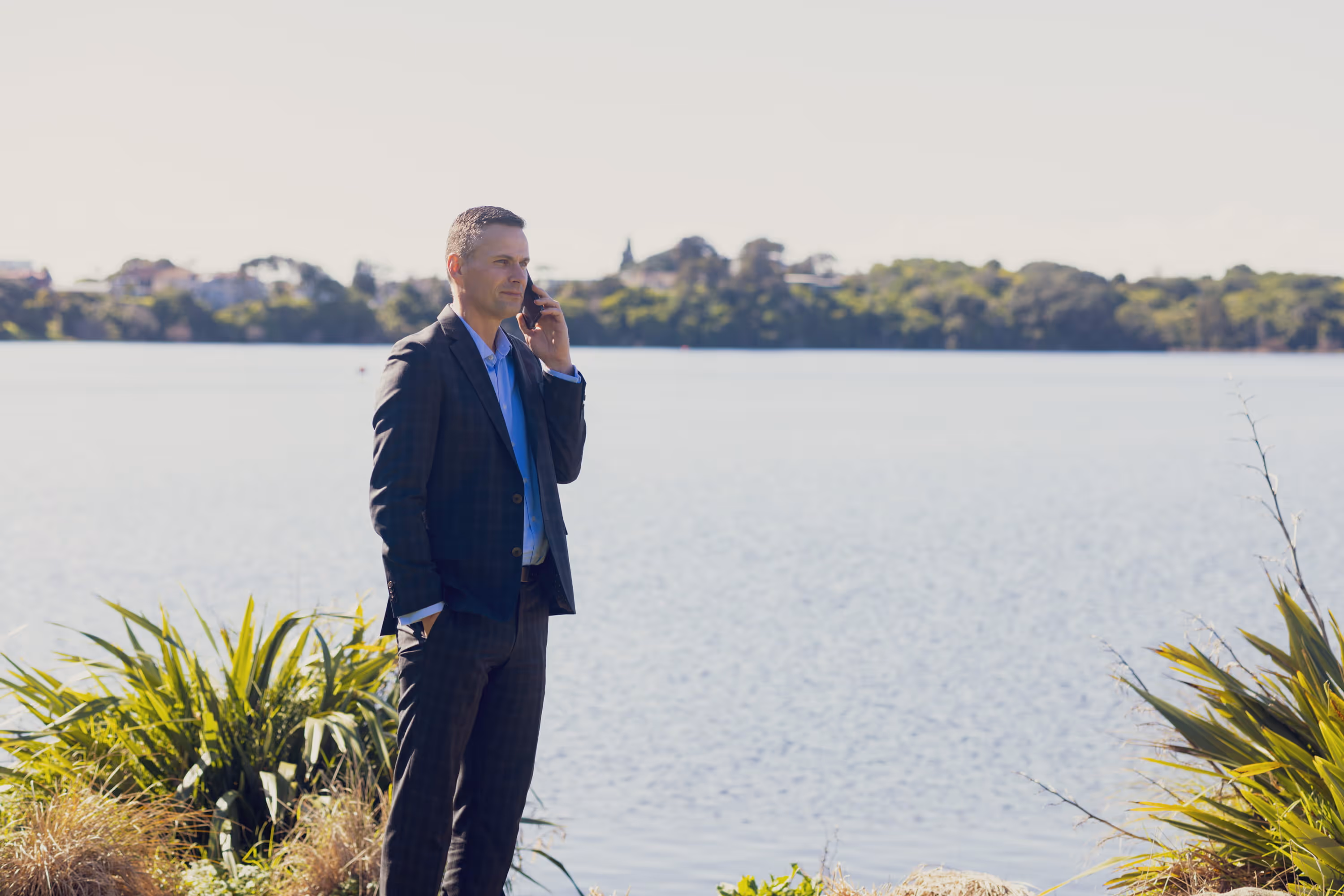 Financial Planning Service with Become Wealth New Zealand. Picture of adviser on phone.