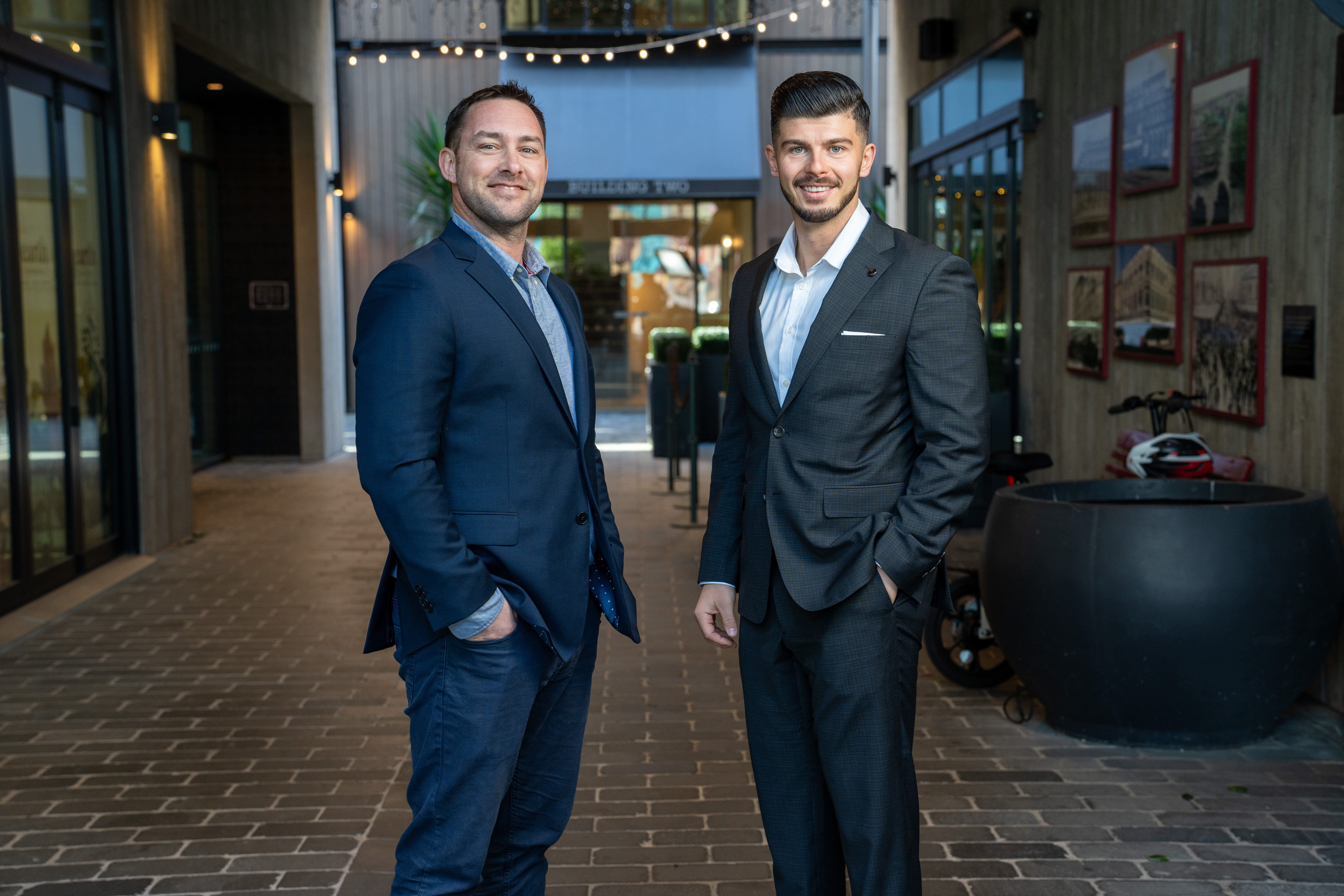 Mortgage advisers at Become Wealth, standing, facing camera