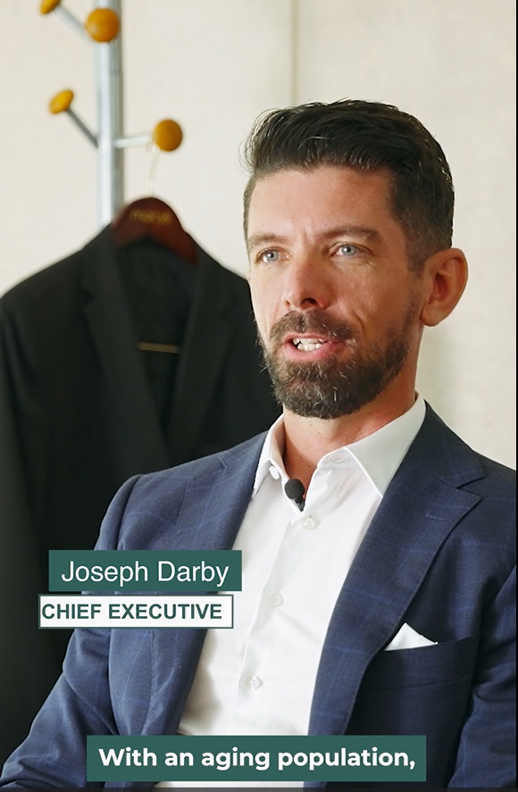 CEO of Become Wealth, Joseph Darby, seated. Discussing potential economic impact on NZ's retirees