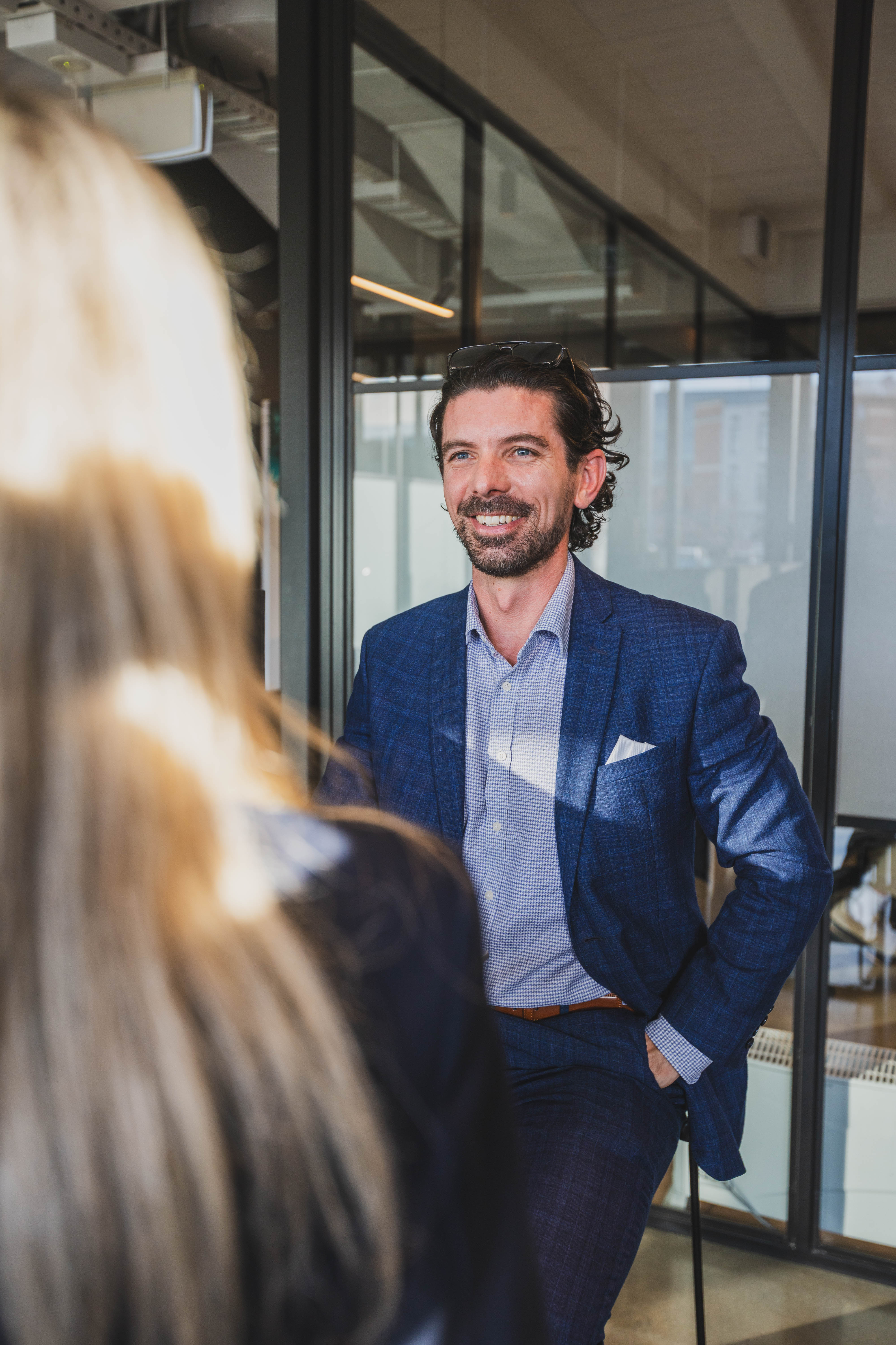 Joseph Darby, CEO of Become Wealth, laughing with a client