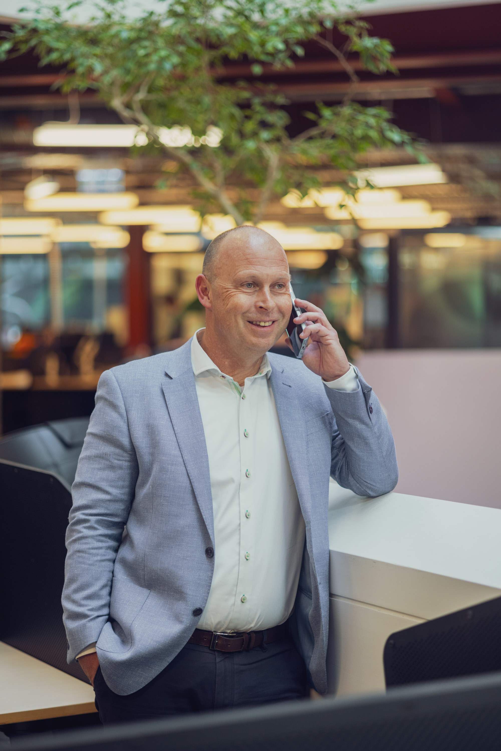 Hayden, a financial adviser at Become Wealth, speaking on the phone to a client