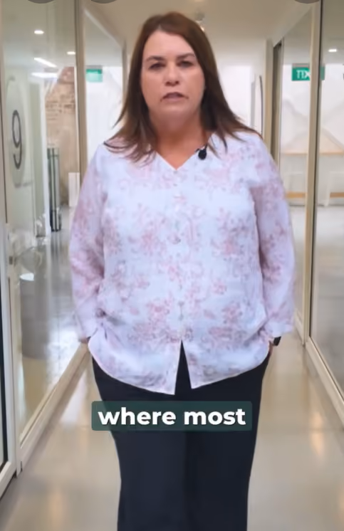 Vinessa Orsbourn, standing in an office corridor, discusses why many investors stall at $500k