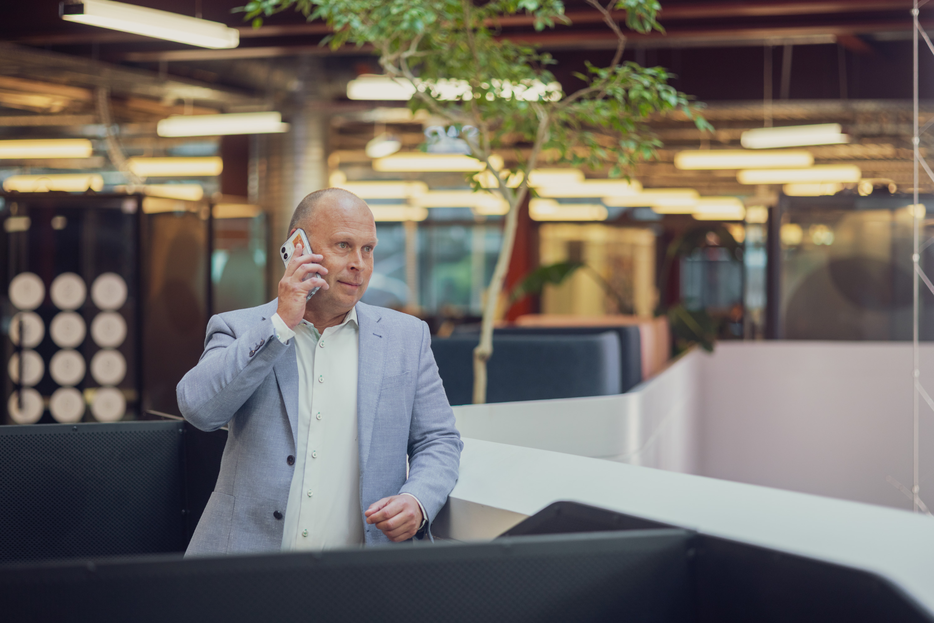 Hayden, a financial adviser at Become Wealth, on the phone to a client