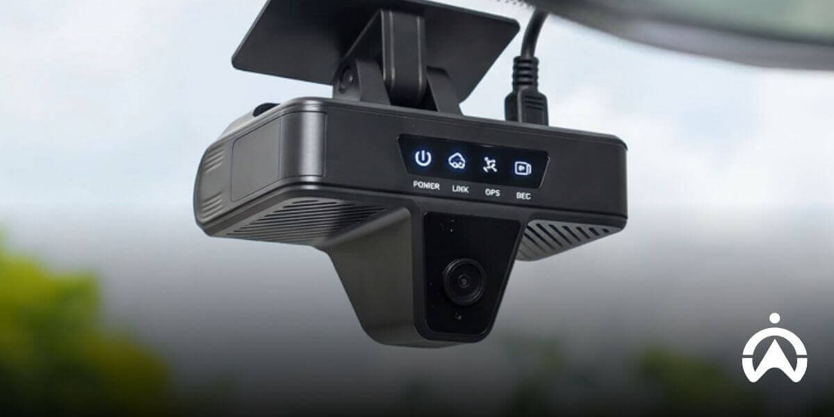 Black windshield-mounted AI dashcam with status lights to support safer driver behaviour and compliance.