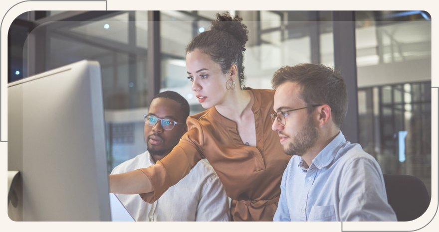 IT team reviewing systems and infrastructure data on screen