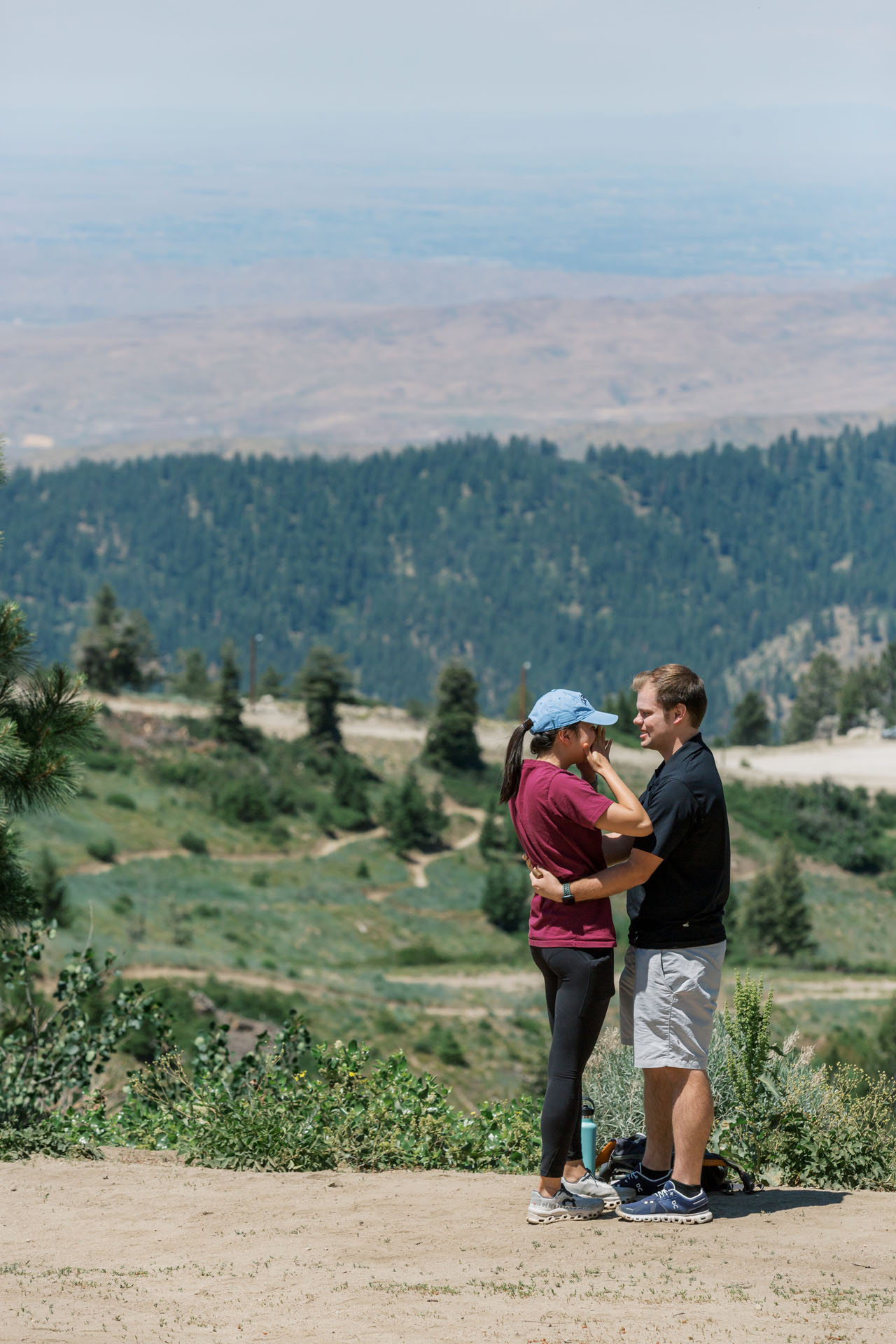 girl wiping tears after surprise proposal in Boise