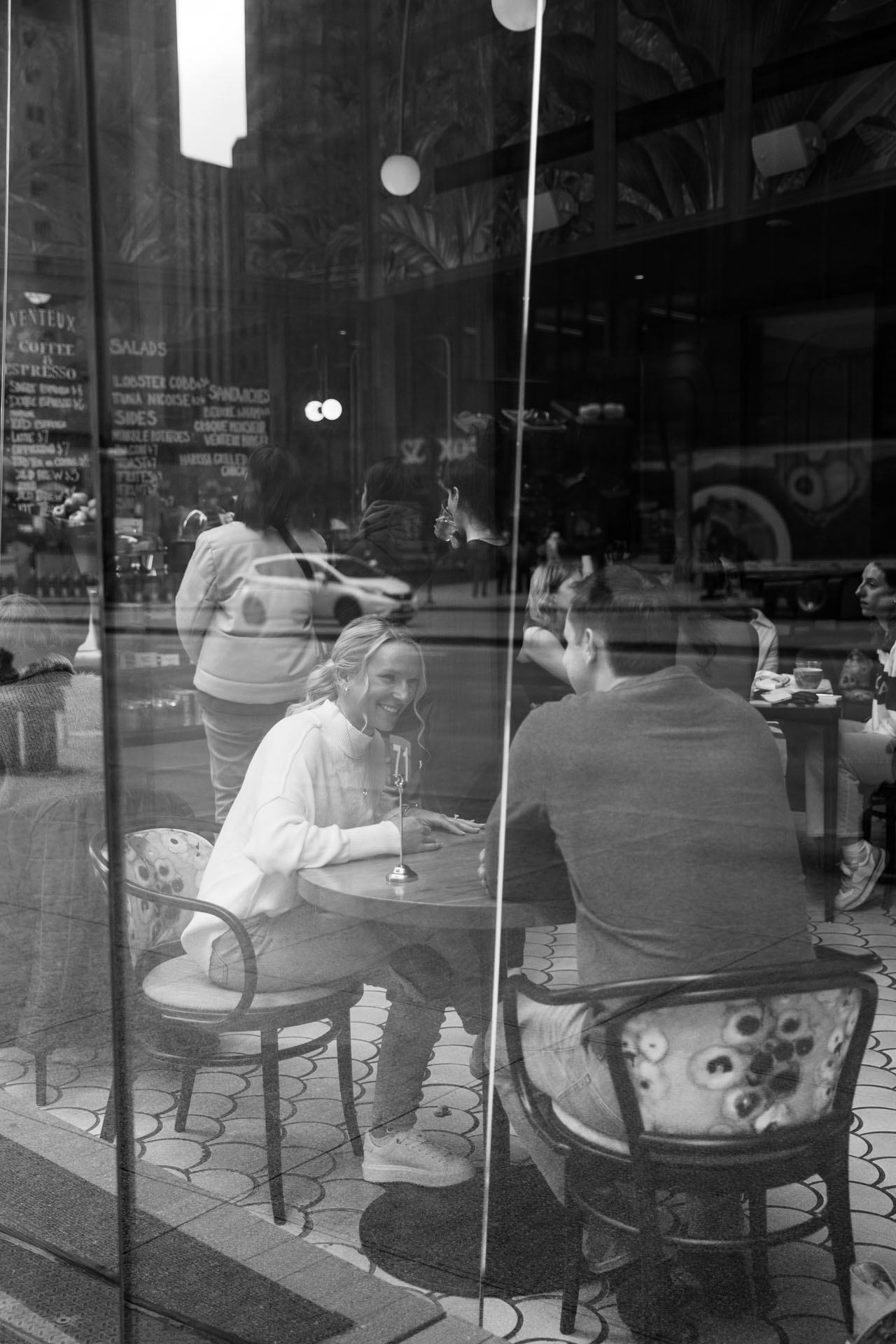 couple at a coffee shop for engagement photos