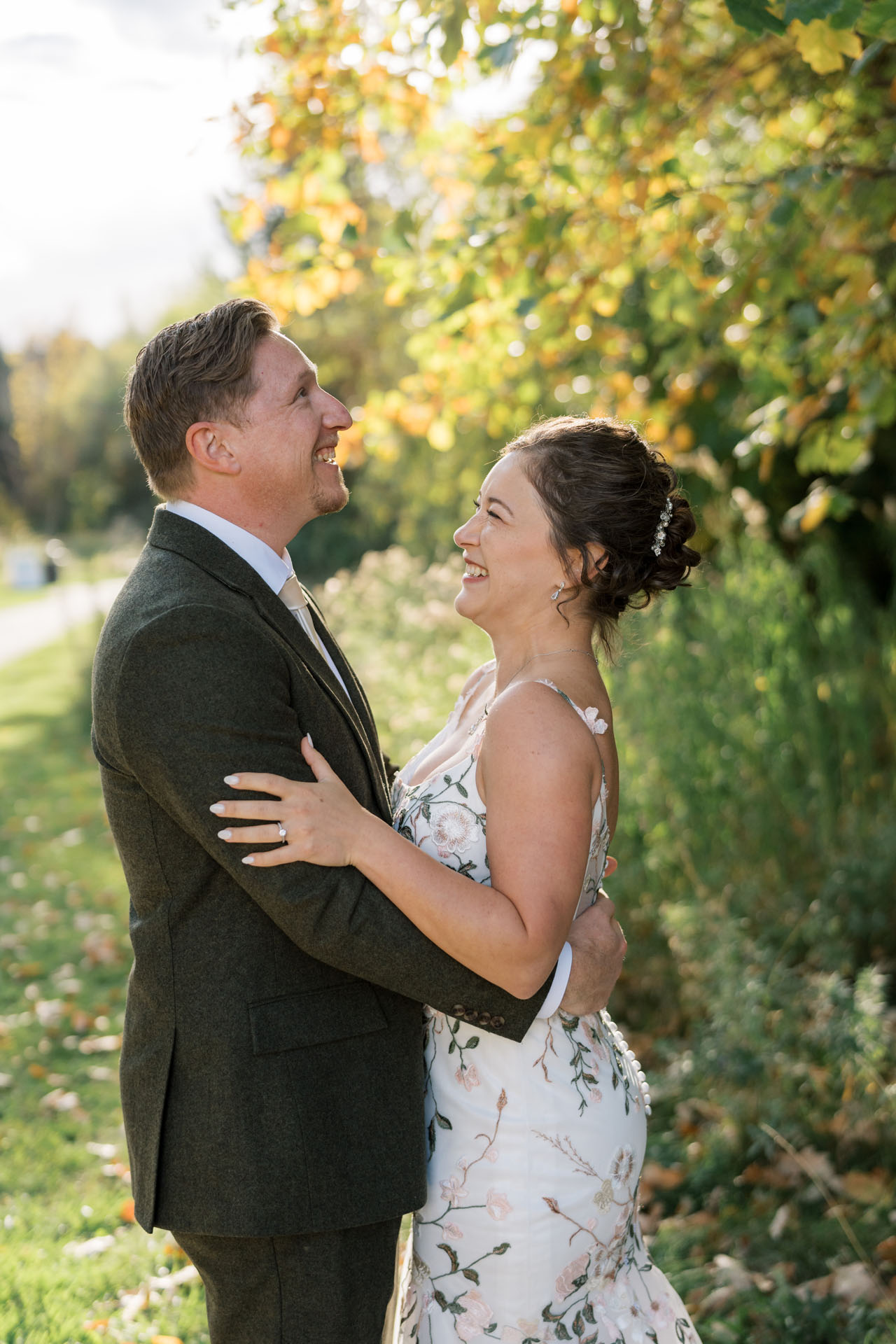 bride and groom laughing together