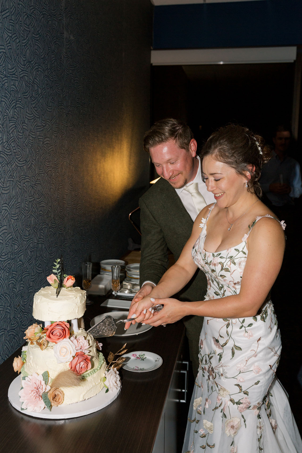 bride and groom cutting their wedding cake