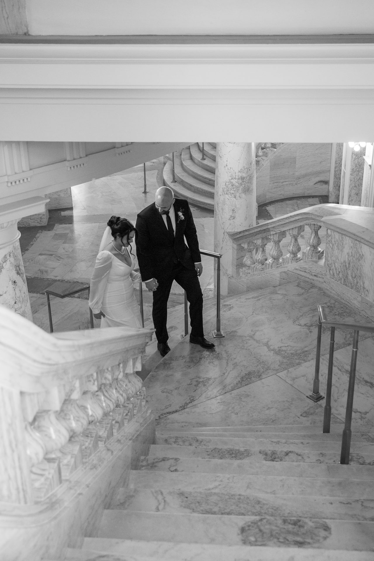 bride and groom walking out of Capitol building