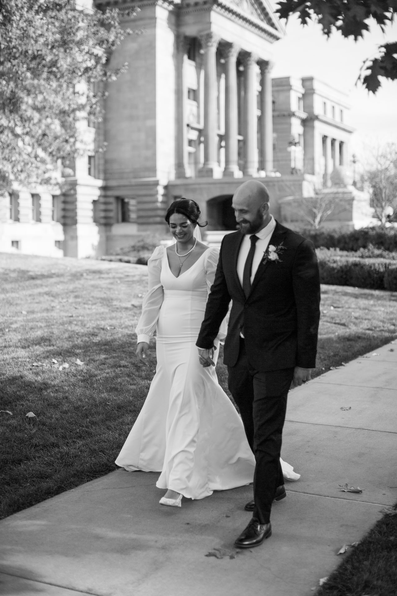 bride and groom walking downtown boise