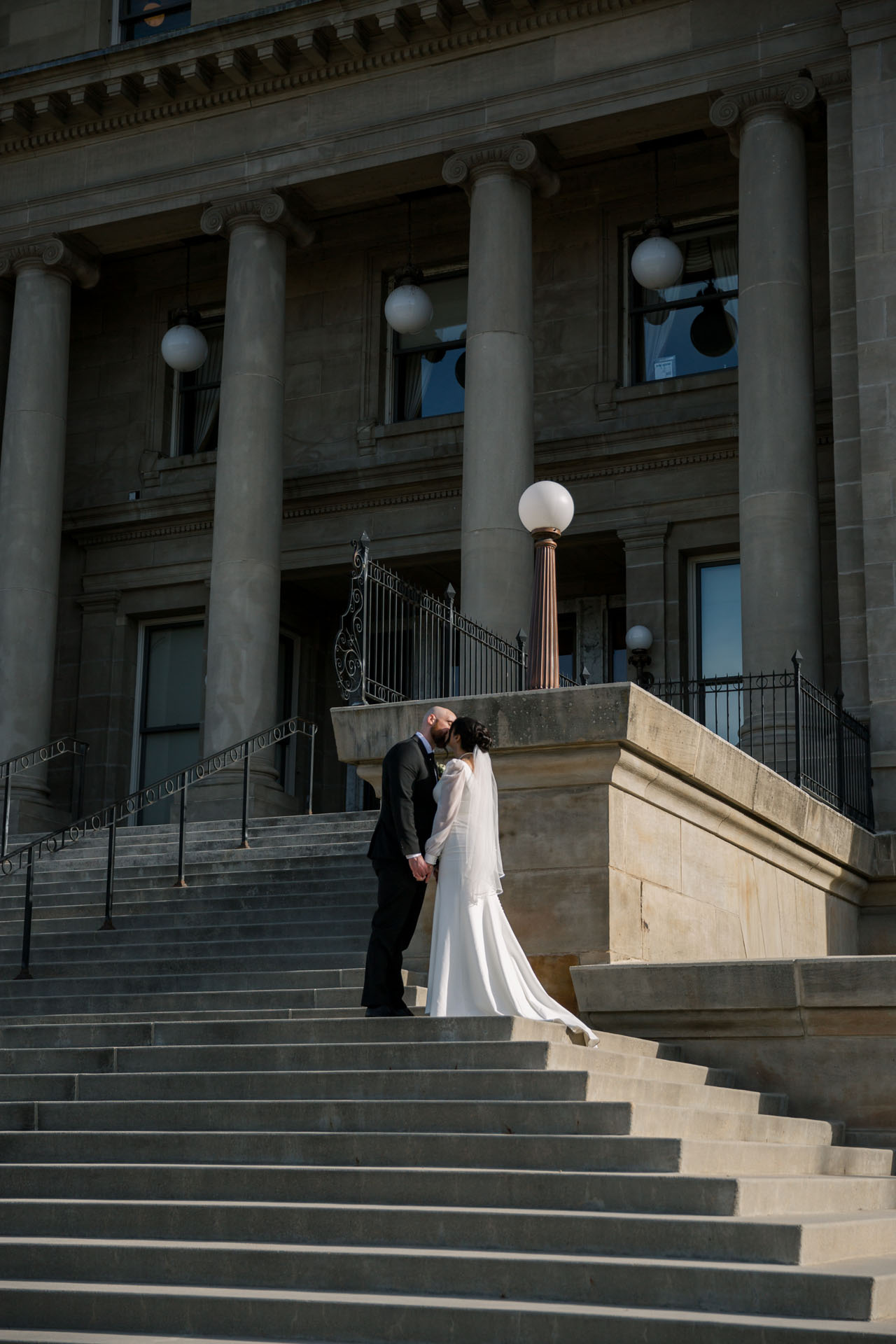 bride and groom on Capitol steps