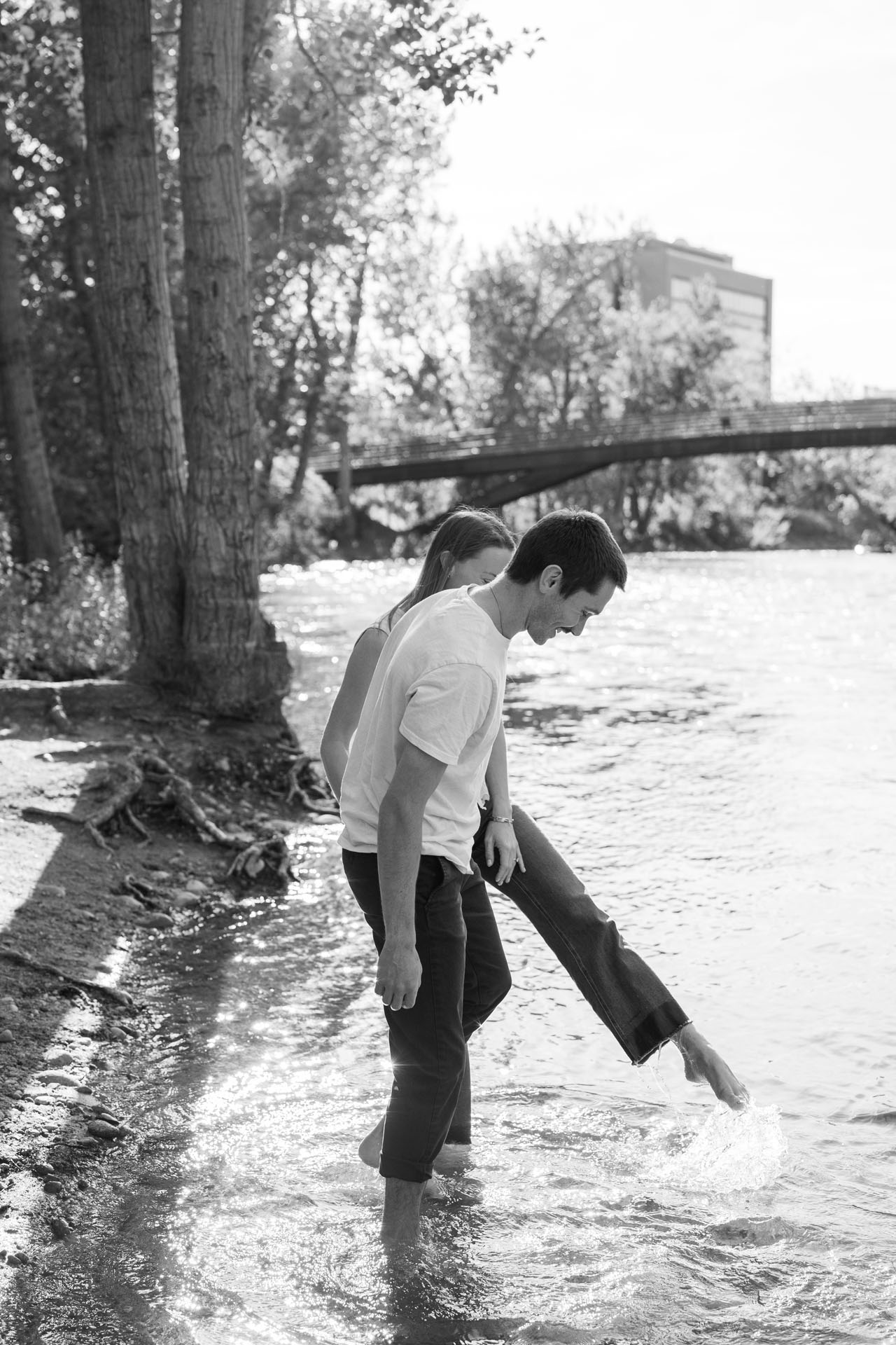 couple splashing their feet in the river