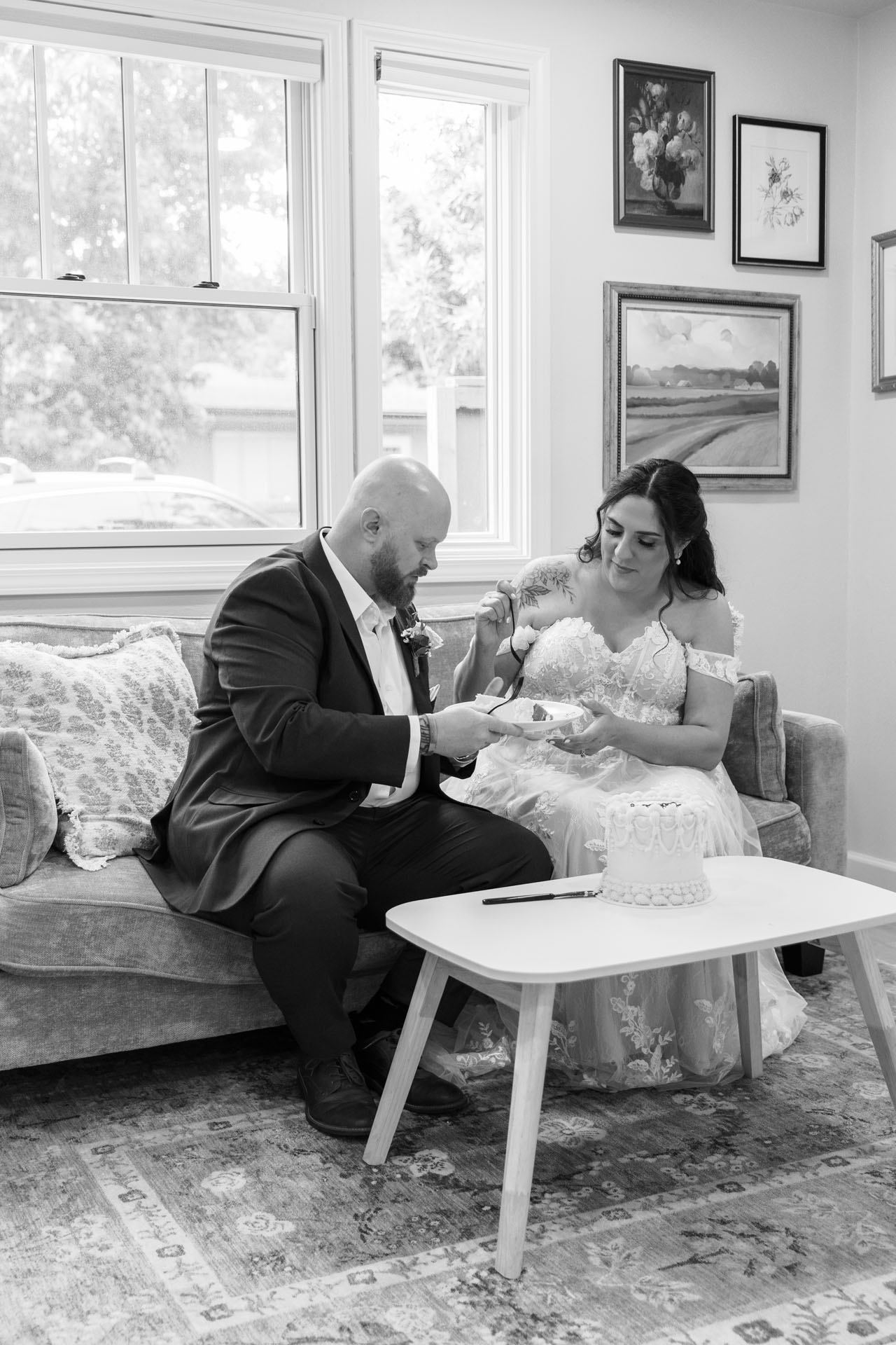 couple eating wedding cake
