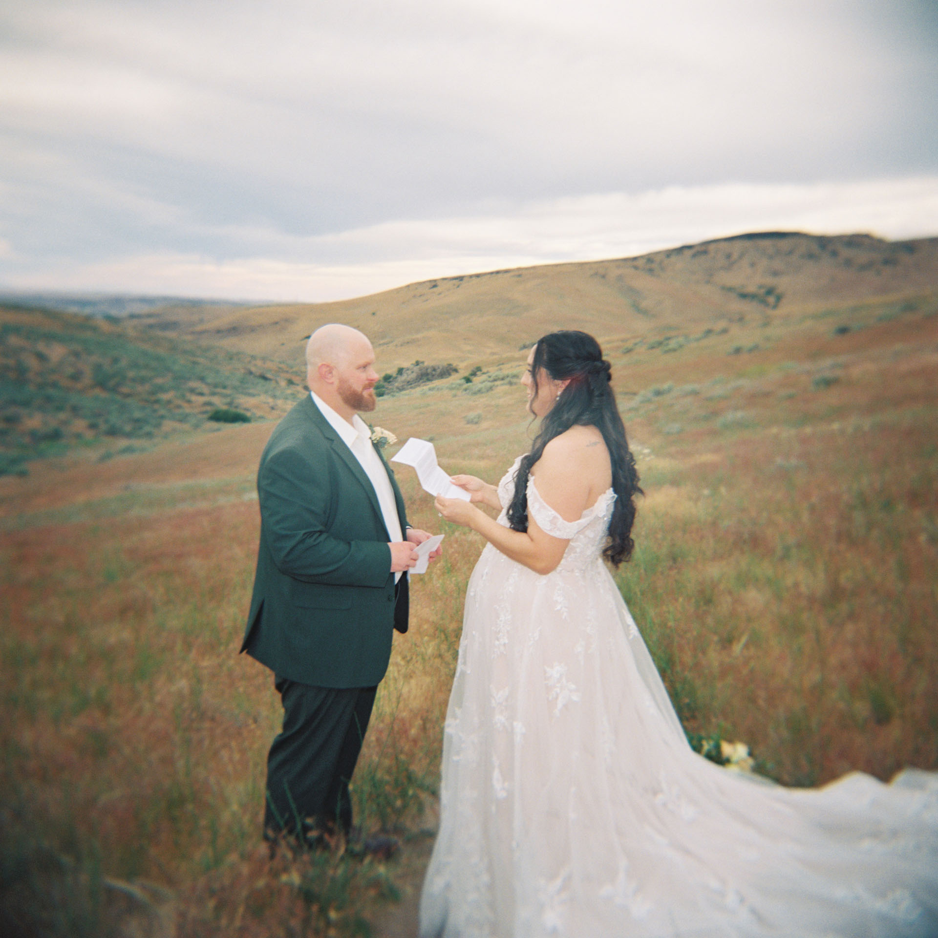 film photograph of couple reading vows