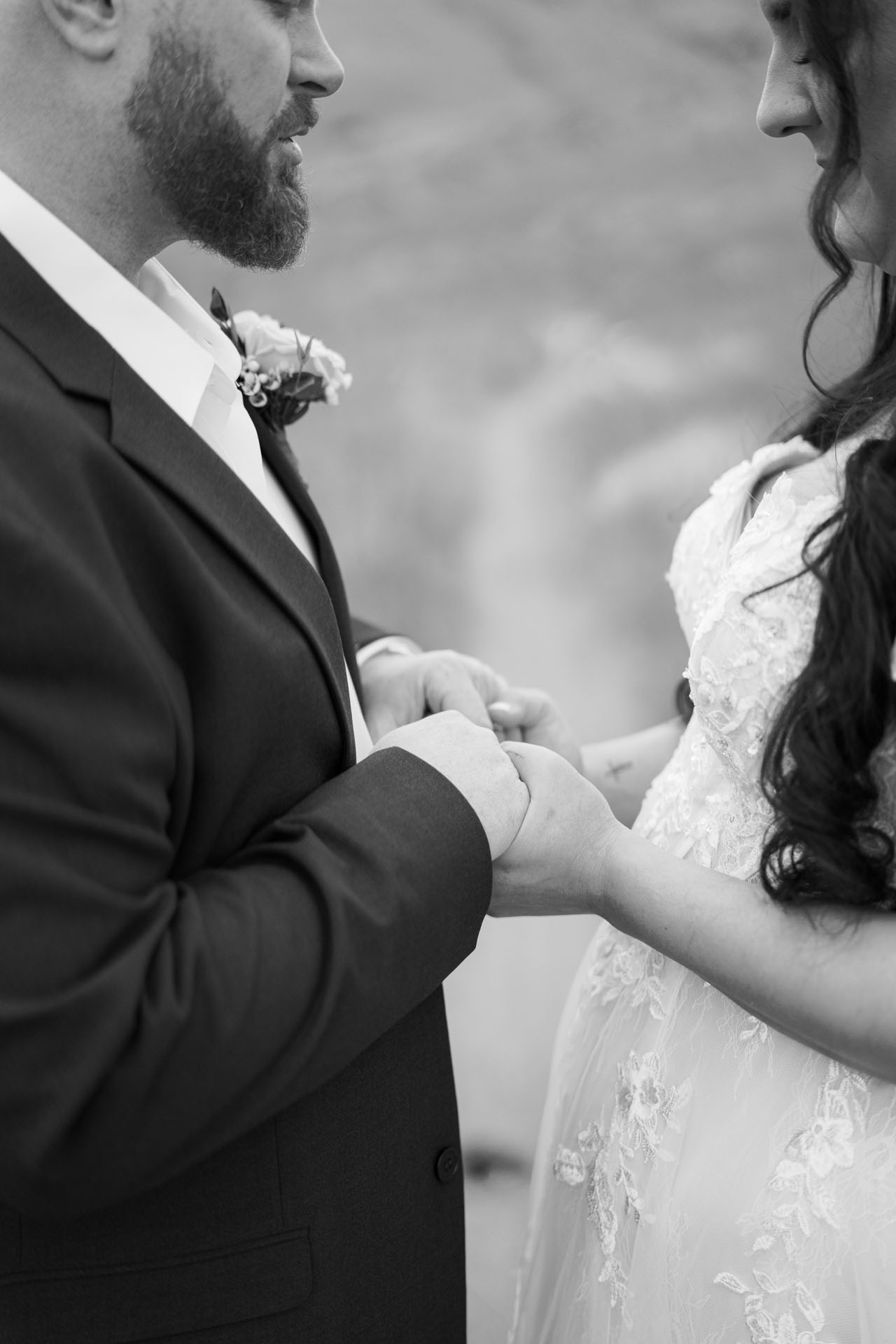 couple holding hands at elopement