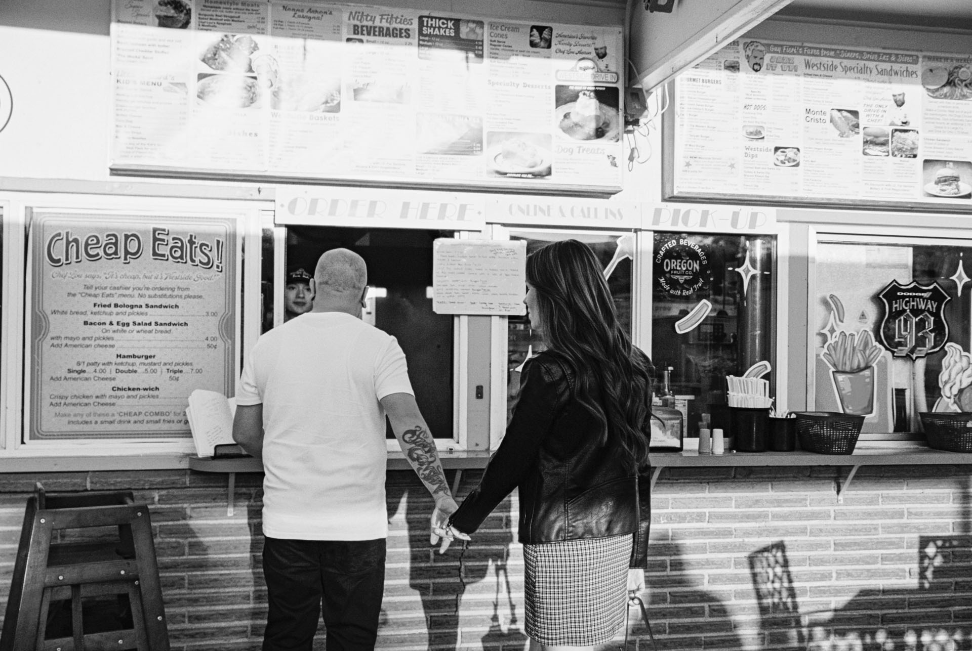couple ordering food at a drive in