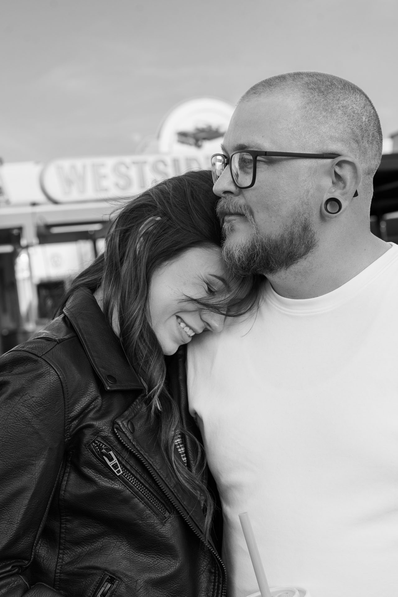 girl with her head on boy's shoulder