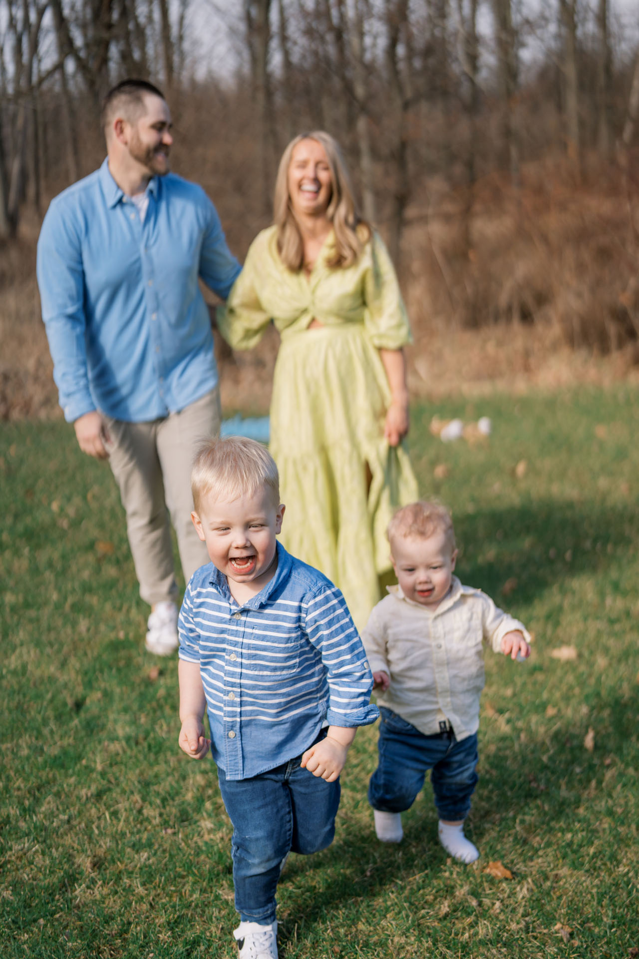 kids running and their parents laughing in the background