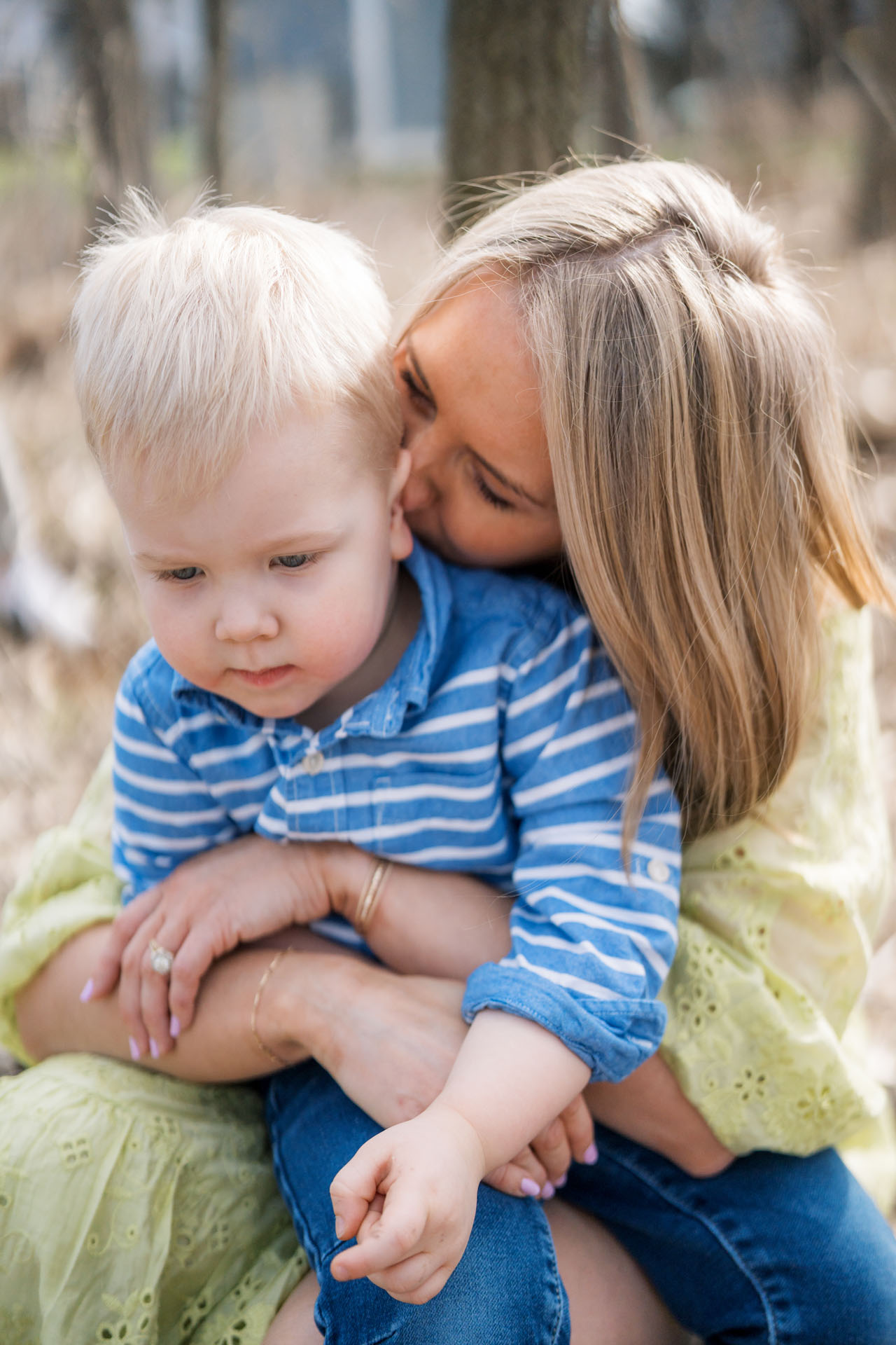 mom kissing her son's head