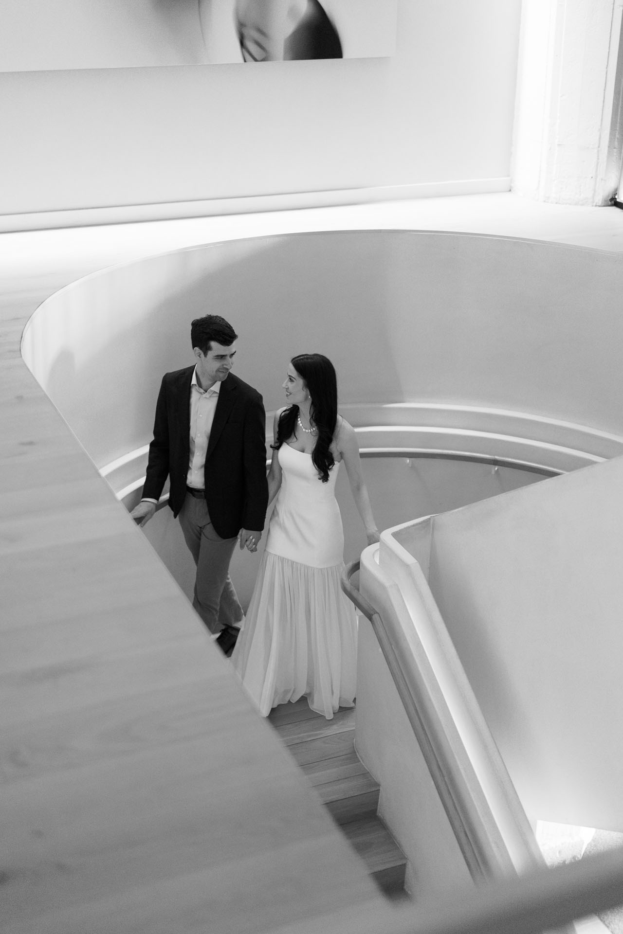 bride and groom walking downstairs at BIAN