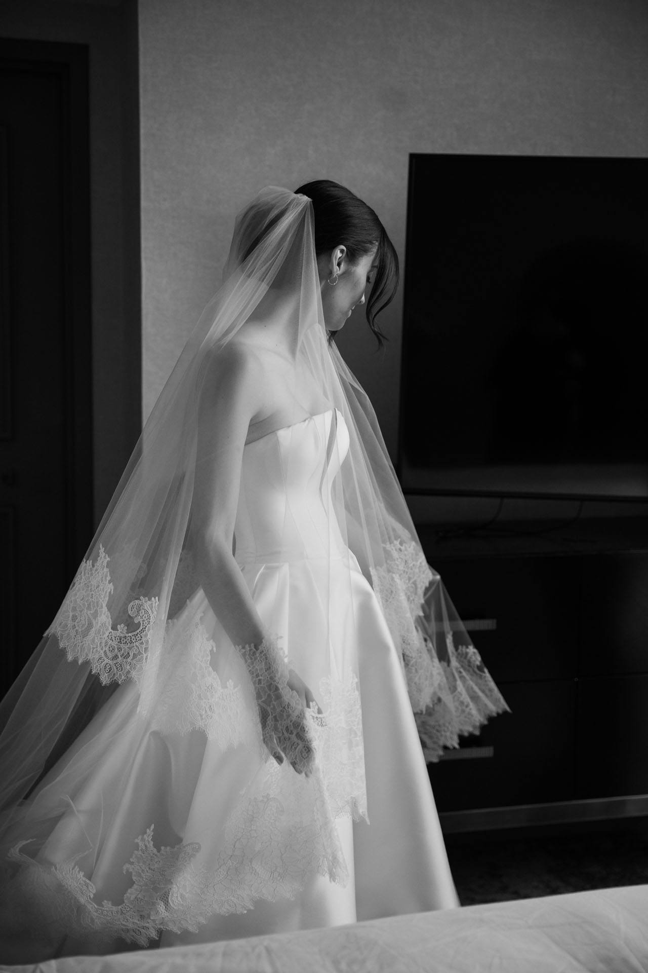black and white bridal portrait while getting ready