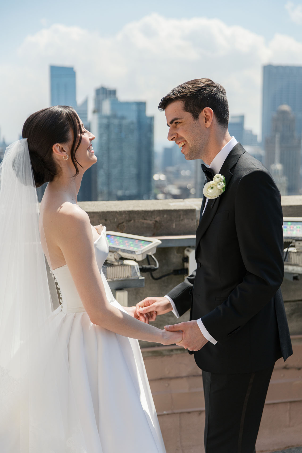 bride and groom laughing during rooftop wedding photos in Chicago