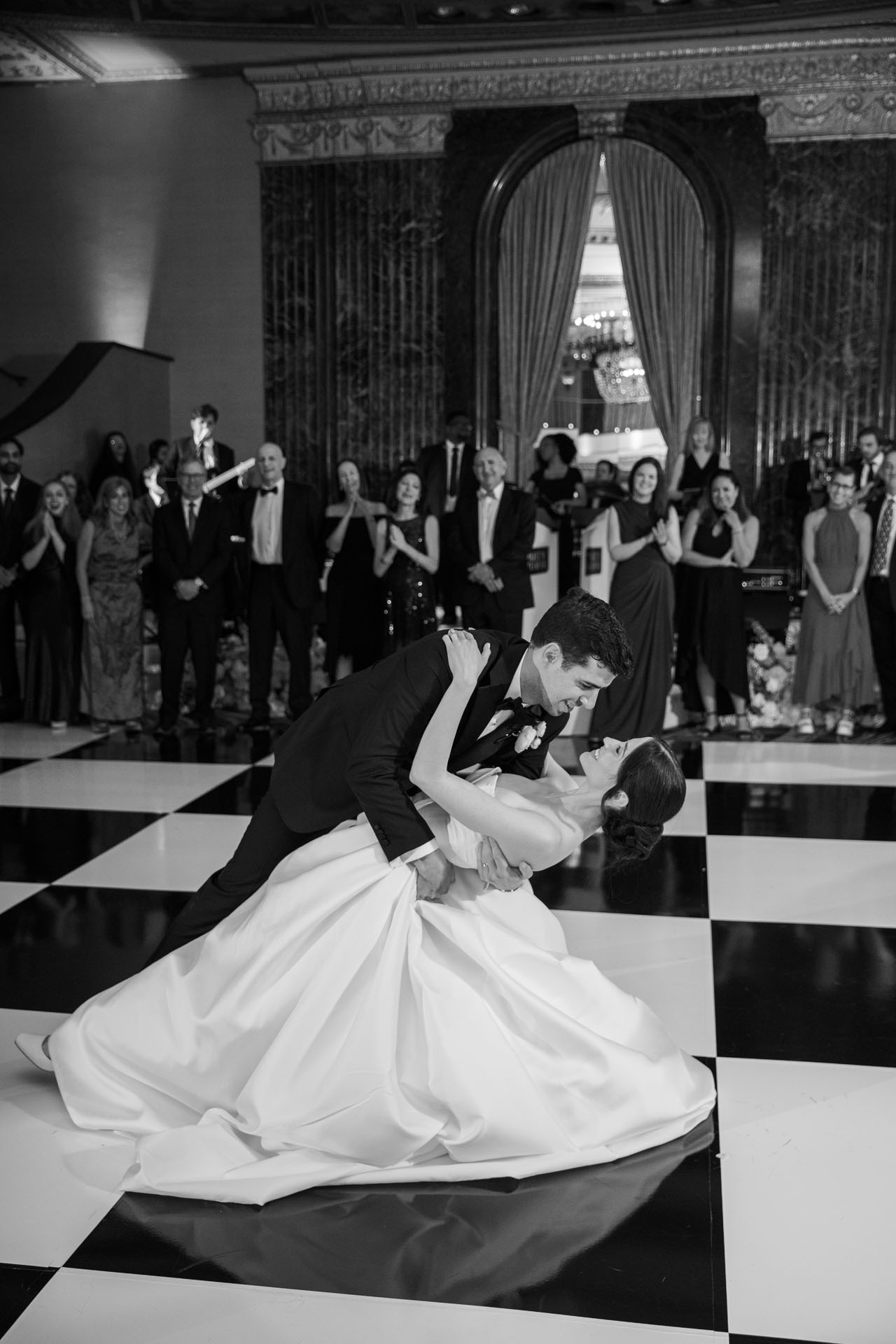 groom dipping bride during first dance