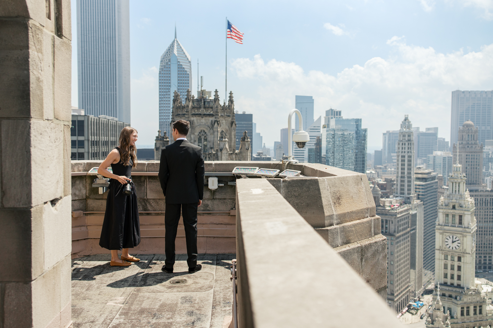 photographer from Studio Ostendo, Co. with the groom on the rooftop at Intercontinental Chicago