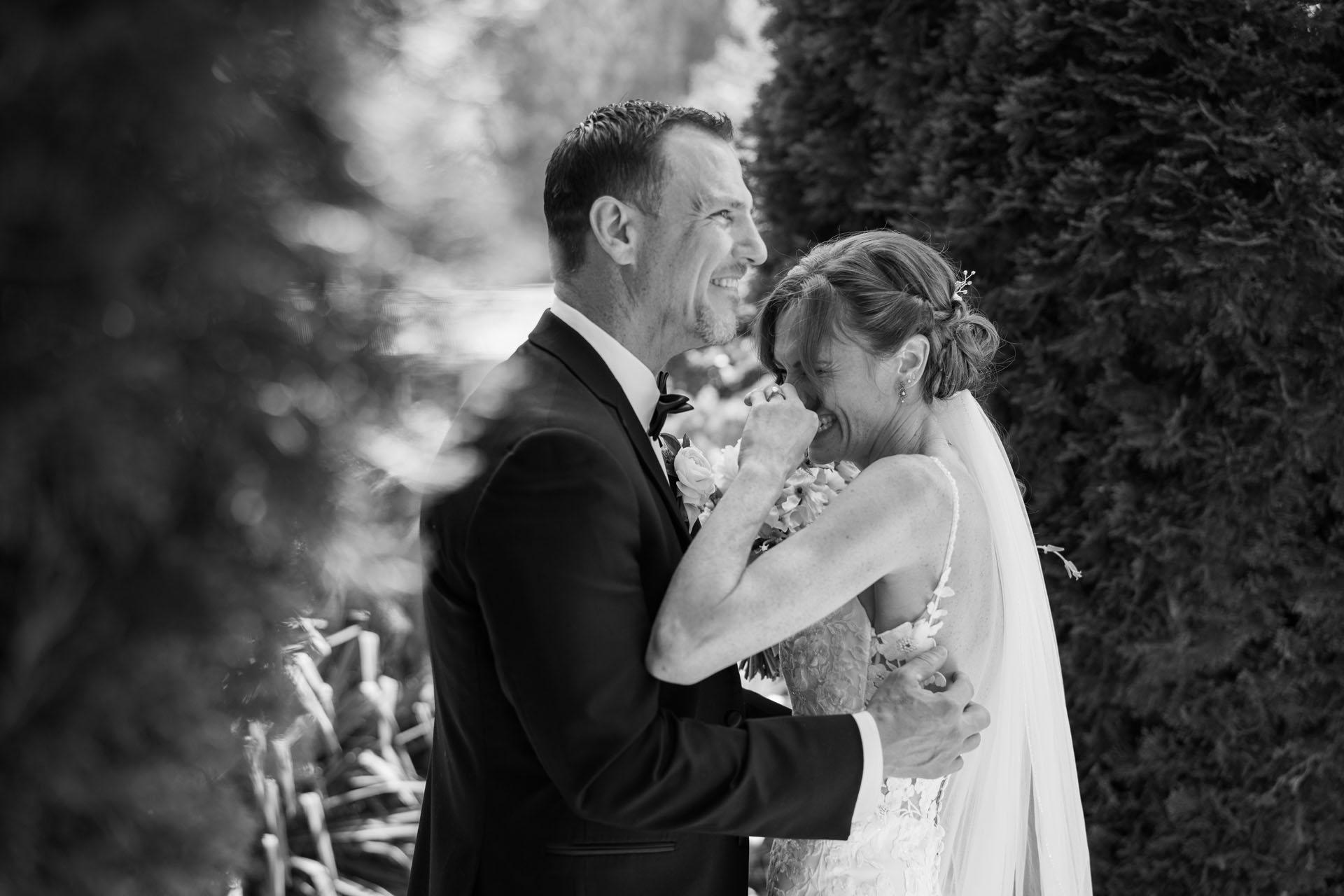bride and groom laughing