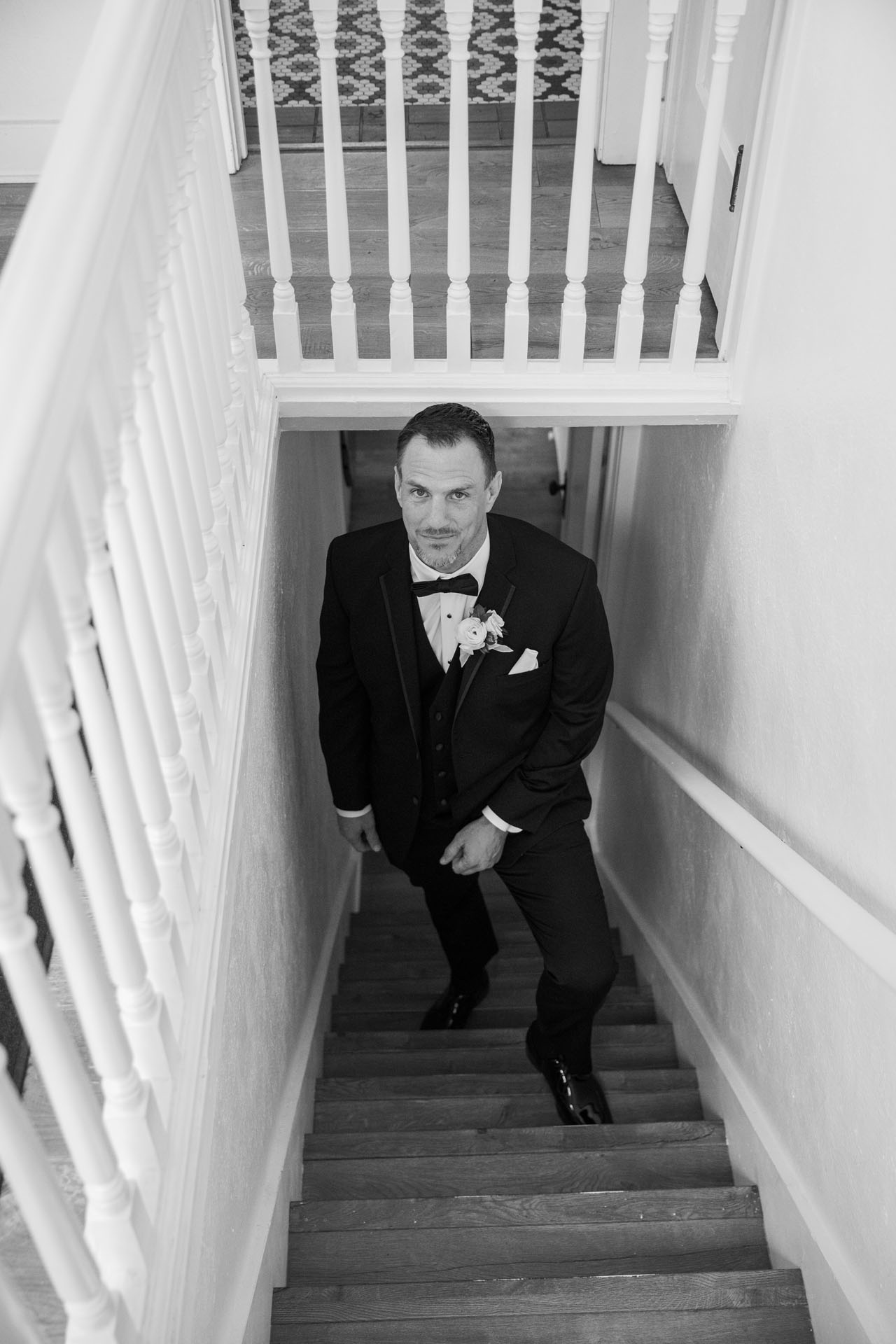 groom getting ready to come upstairs