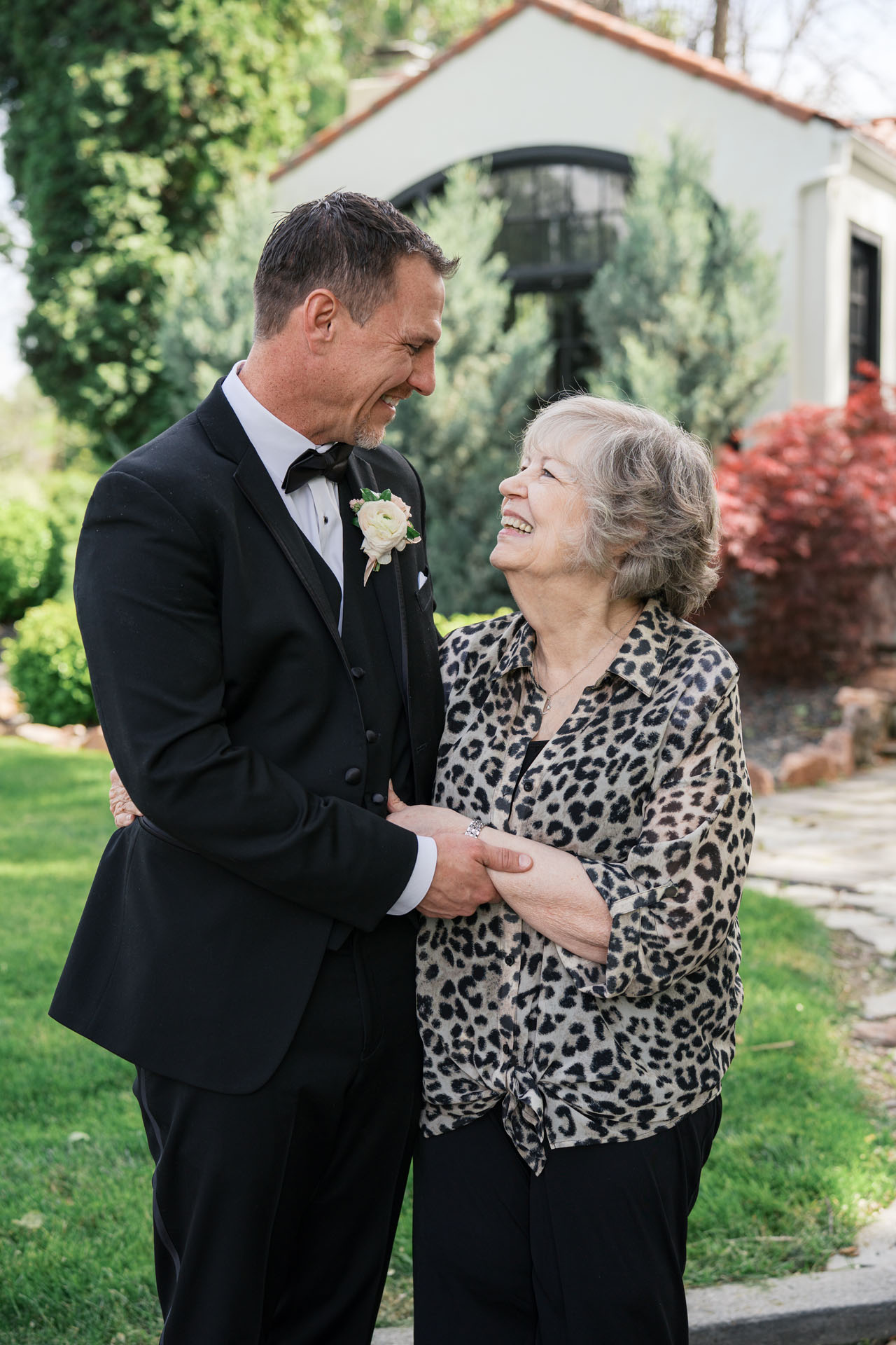 groom smiling at his mom