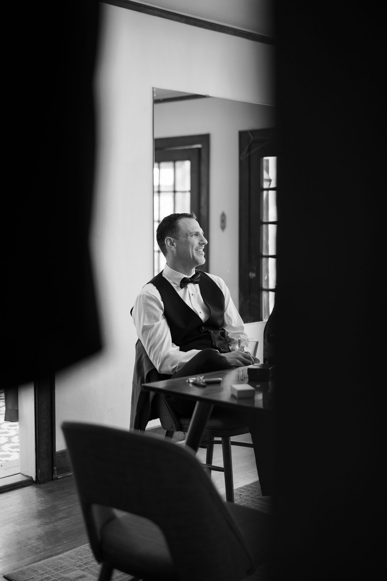 groom sitting at the table before his wedding