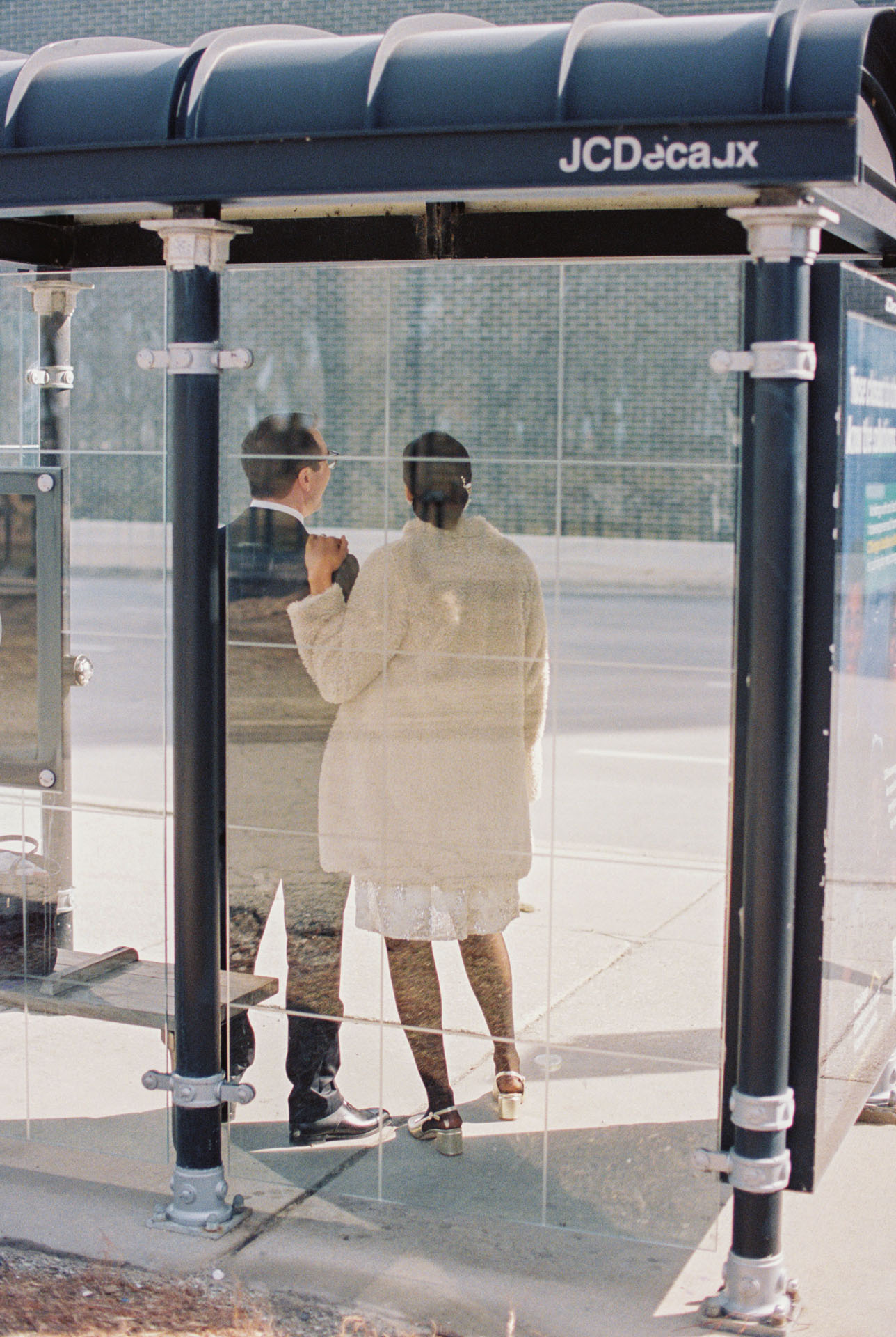 couple waiting at a bus stop in Chicago