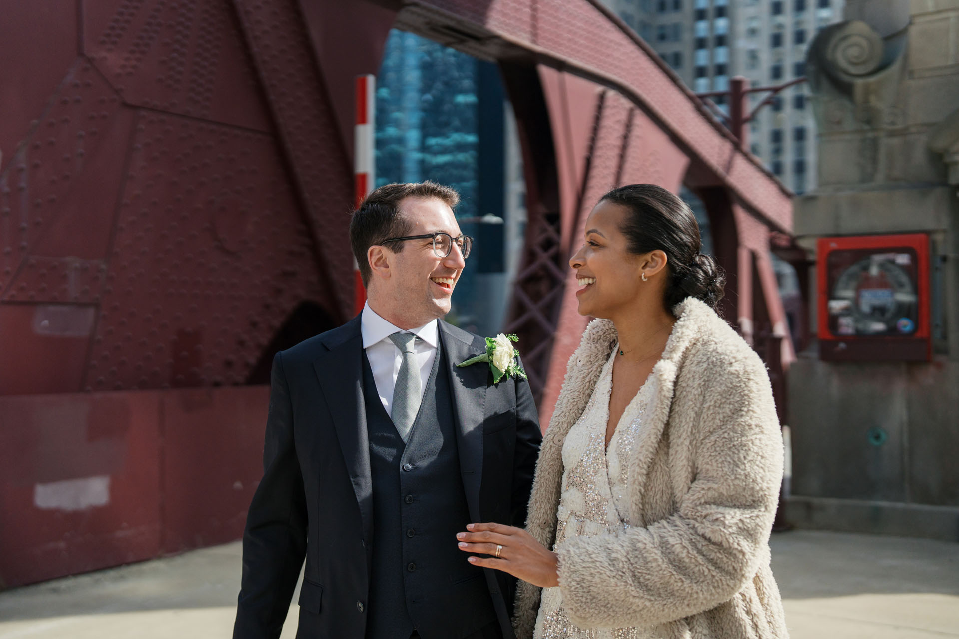 bride and groom walking in Chicago