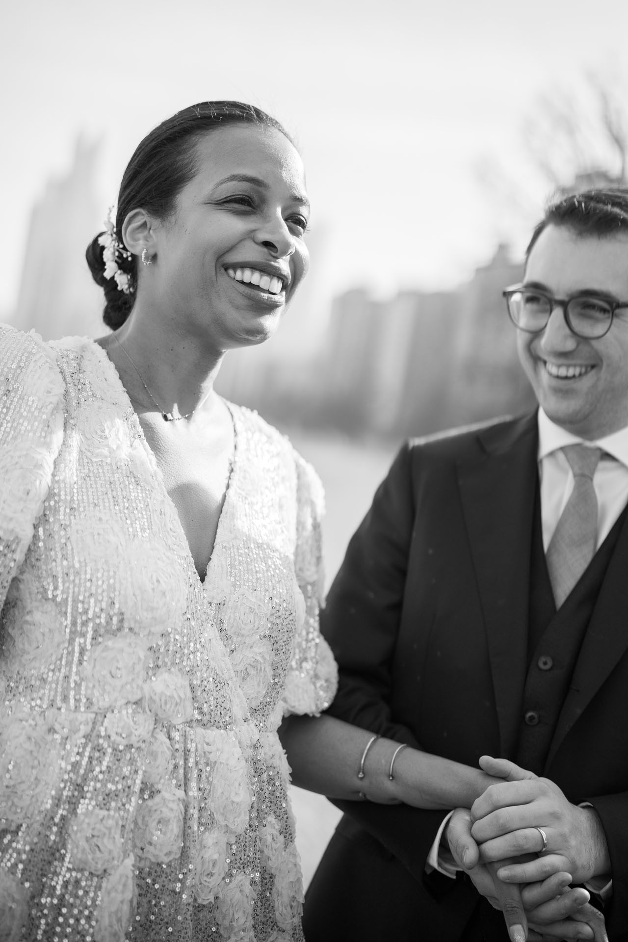 black and white portrait of groom looking at bride