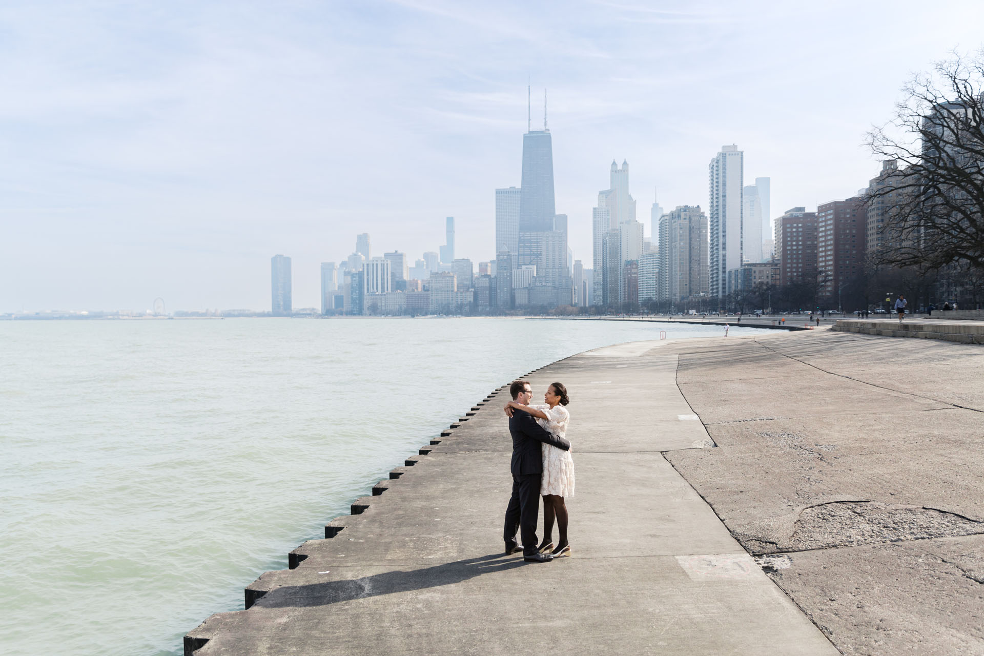 bride and groom with the Chicago lakefront and skyline in the background