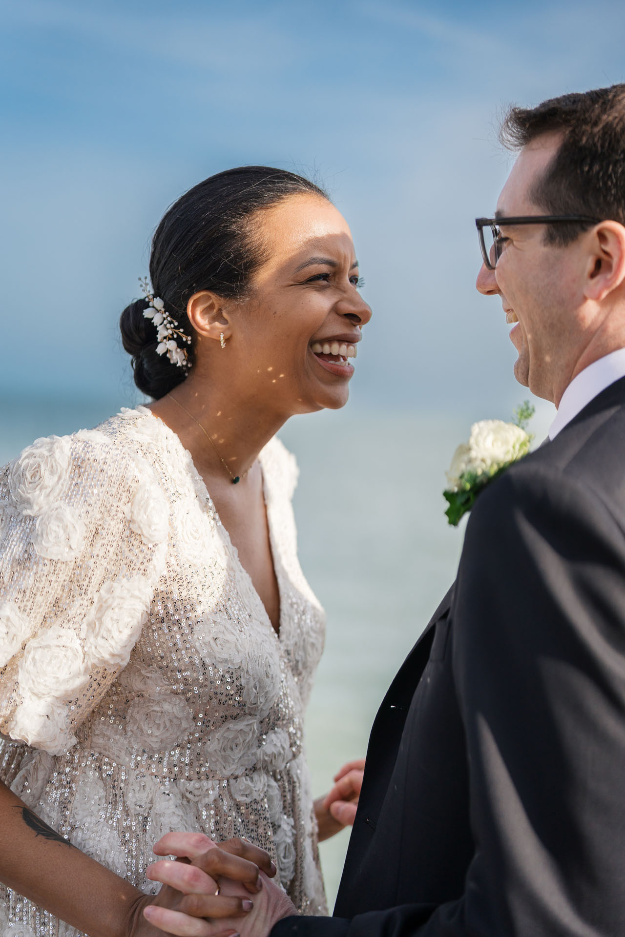 bride and groom laughing together