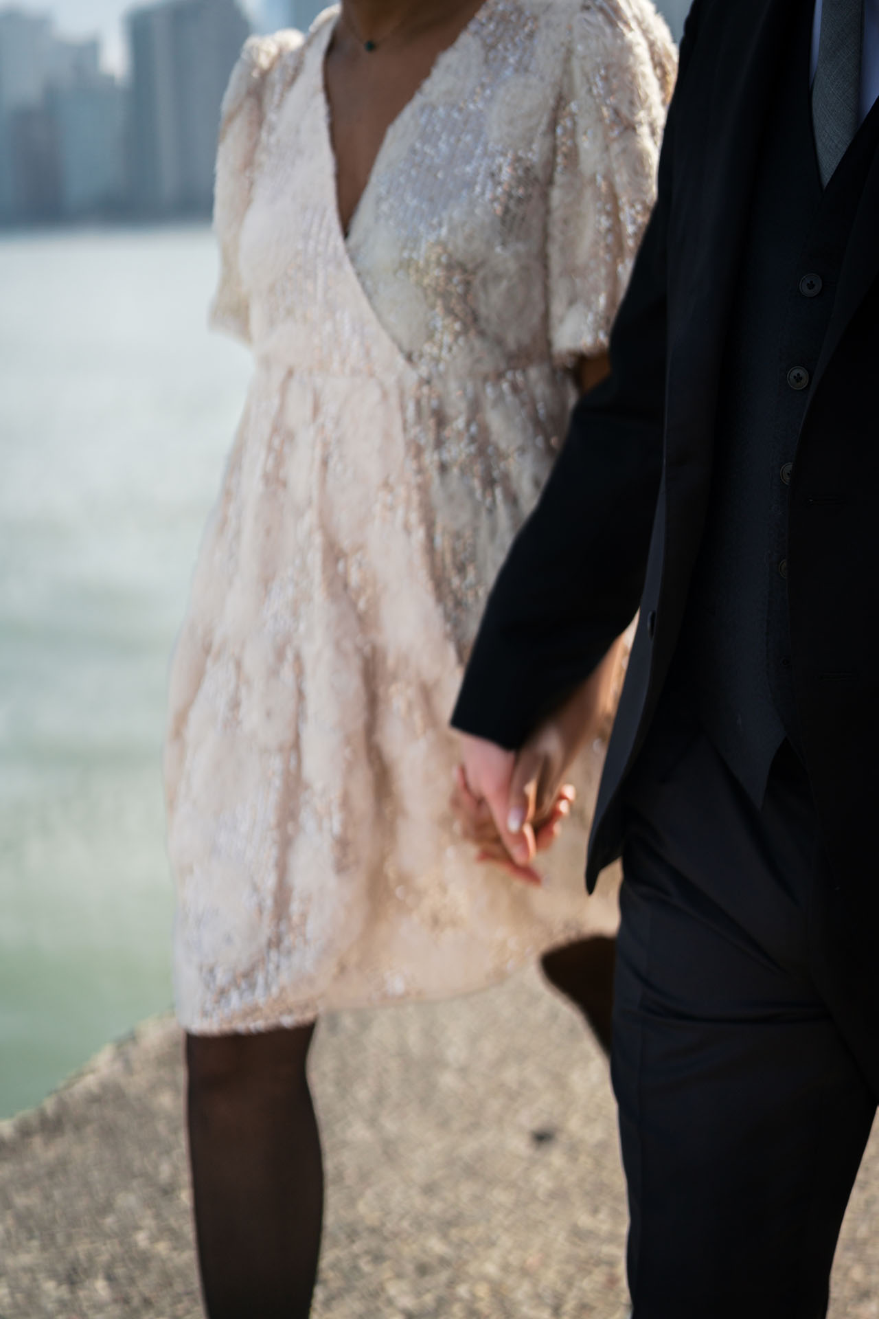 bride and groom holding hands