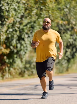Man jogging outdoors with energy and confidence after men’s health treatment through Phoenix online clinic in Canada