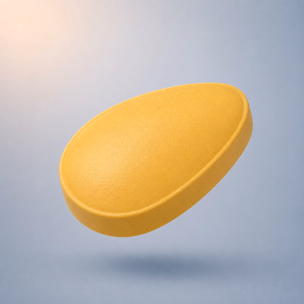Phoenix ED treatment tablet in yellow, shown floating against a soft grey background