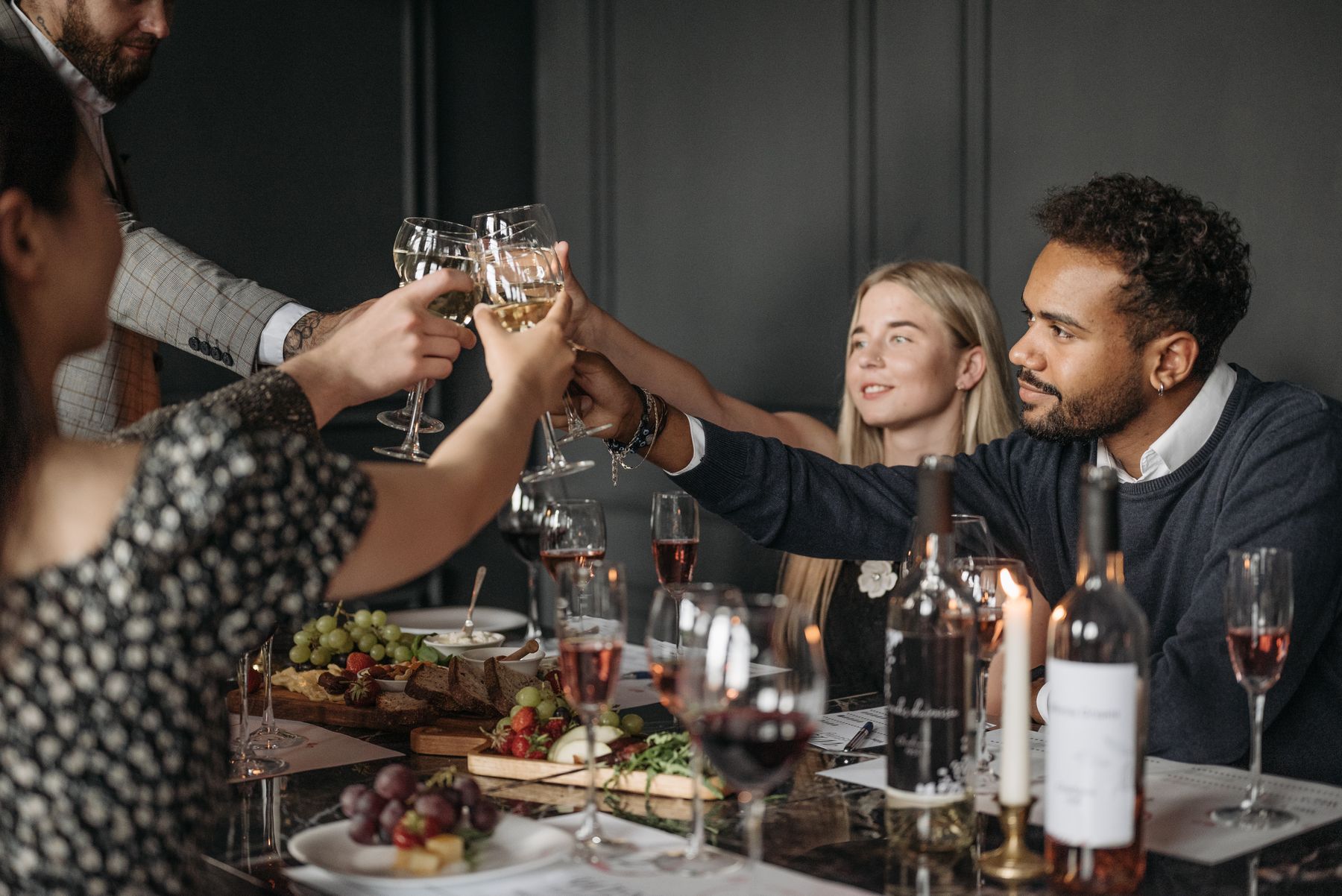 Guests sharing a toast around a dinner table