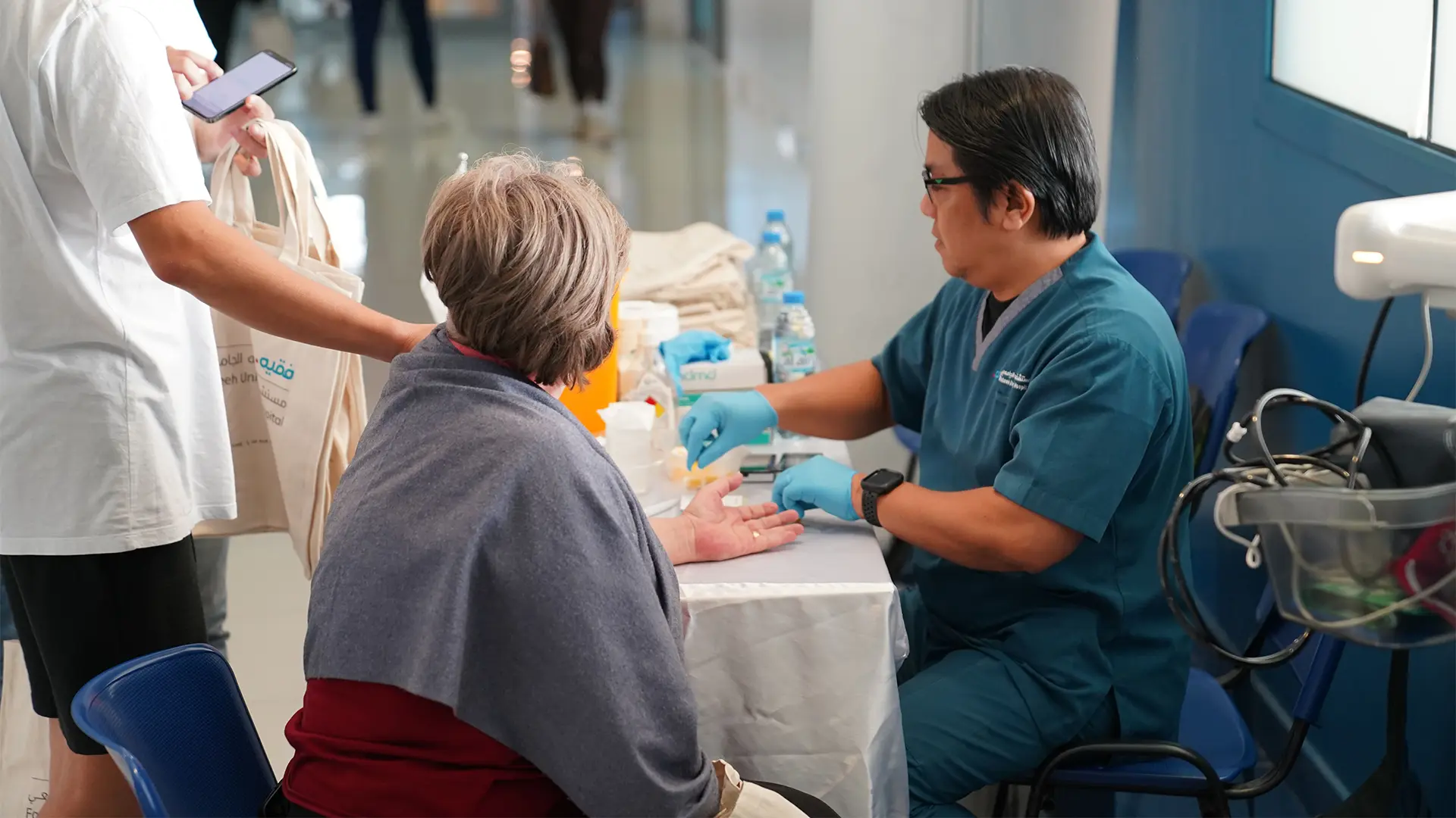 A picture of the nurse treating a patient at Hamdan Sports Complex Dubai