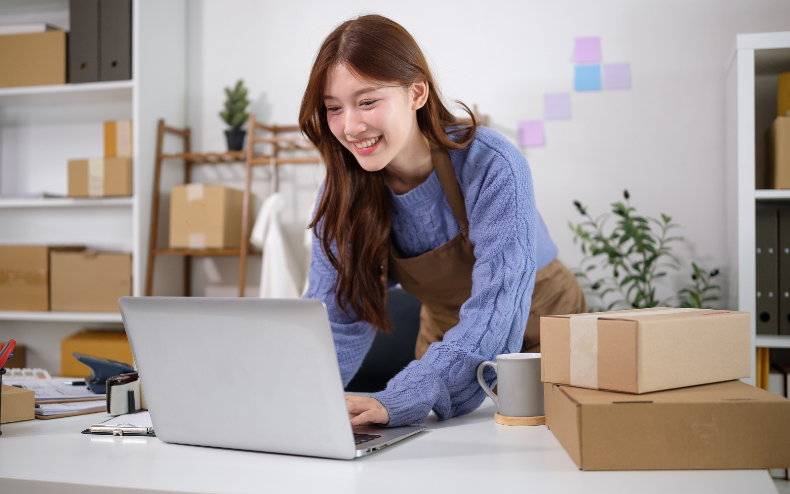 Person checking their laptop.