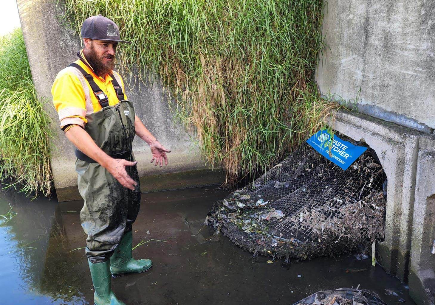 WasteCatcher installer inspecting outlet