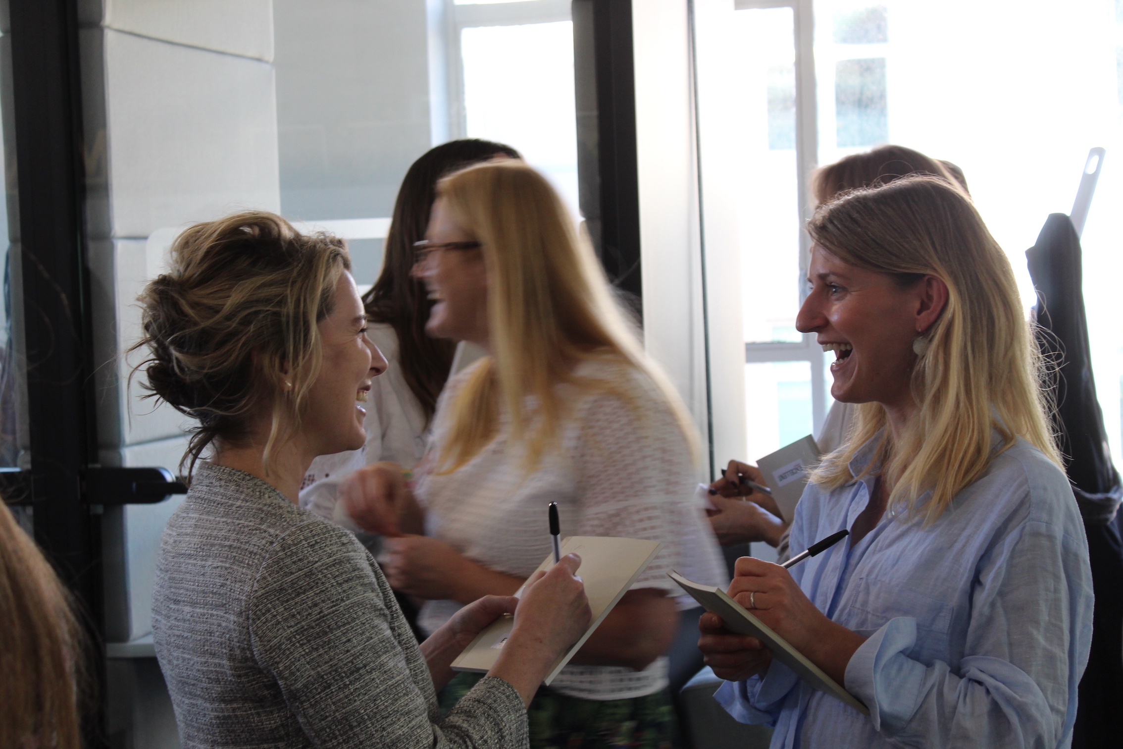 An image from the Community In person event of people laughing