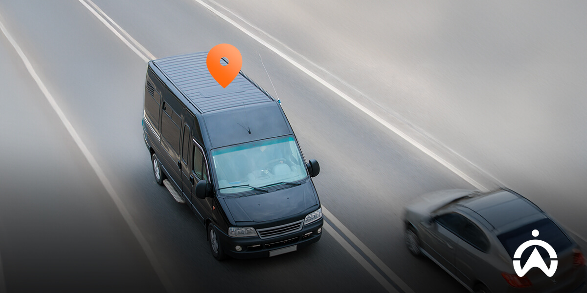 Cartrack GPS tracker vs AirTag comparison with black van on highway marked by location pin.
